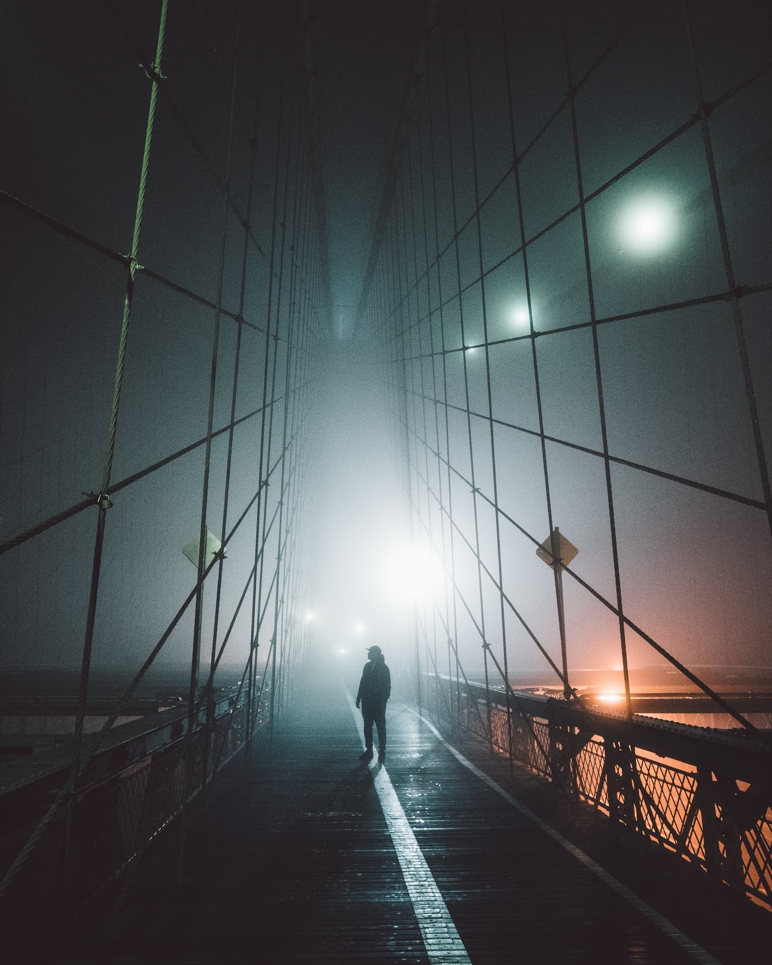 Brooklyn Bridge shrouded in morning fog